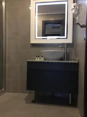 a bathroom with a sink and a mirror at GRAND MEDYA HOTEL-OLDTOWN in Istanbul