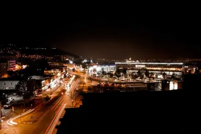a city lit up at night with street lights at Dimen Hotel in Bursa