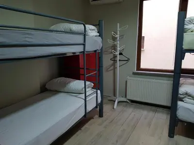 a room with two bunk beds and a window at GRAND BELLA VİSTA Hostel in Istanbul