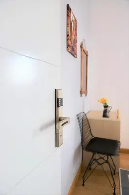 a chair in a room with a wall at Taksim Roya Apartment -center of the Istanbul in Istanbul