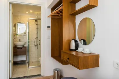 a bathroom with a sink and a mirror at Castillo Rojo Hotel Istanbul in Istanbul