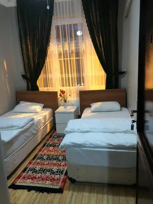 a bedroom with two beds and a window at Bahaus Guest House Hostel Near Sultanahmet & Agia Sofia in Istanbul