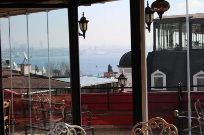 a view of the water from a restaurant with tables and chairs at Bahaus Guest House Hostel Near Sultanahmet & Agia Sofia in Istanbul