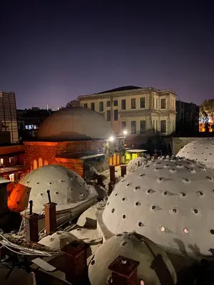 a group of snow covered domes in a city at night at Pege Hotel in Istanbul