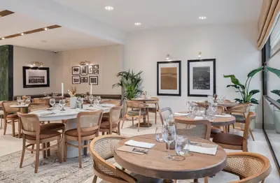 a restaurant with tables and chairs in a room at Delita City Hotel in Istanbul