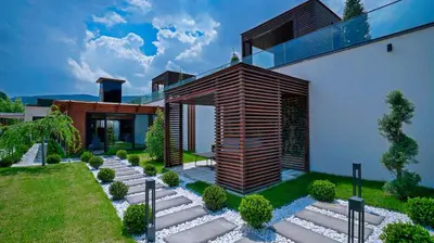 a house with a garden in front of it at Cabir Deluxe Hotel Sapanca in Sapanca