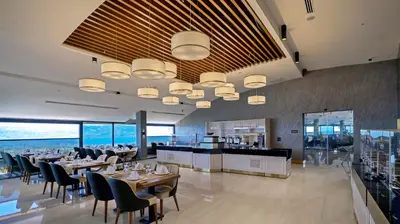 a dining room with tables and chairs in a restaurant at Cabir Deluxe Hotel Sapanca in Sapanca