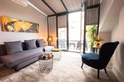 a living room with a couch and a table at Dosso Dossi Hotels Laleli in Istanbul