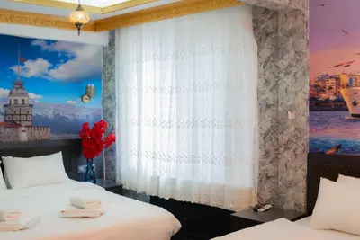 a bedroom with two beds and a window at Golden Horn Park Hotel in Istanbul