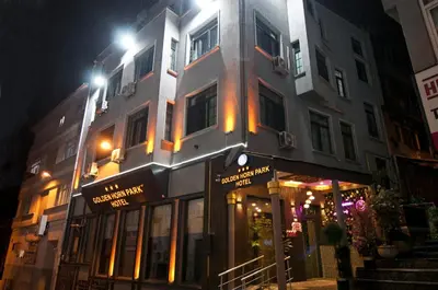 a building with a store front at night at Golden Horn Park Hotel in Istanbul
