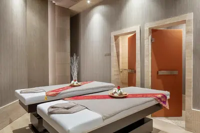 two beds in a room with a shower at Melas Hotel Istanbul in Istanbul