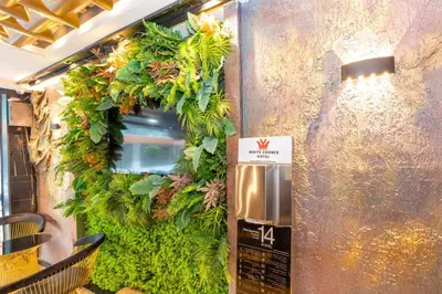 a restaurant with a green wall with a trash can at White Corner Hotel in Istanbul