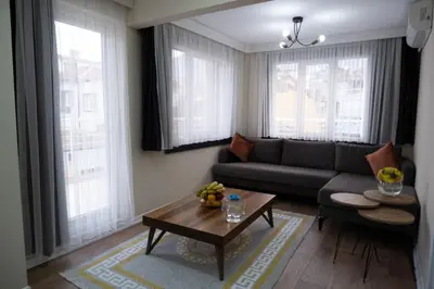 a living room with a couch and a table at GREEN SUITES BURSA in Bursa
