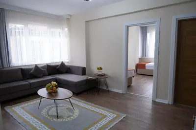 a living room with a couch and a table at GREEN SUITES BURSA in Bursa