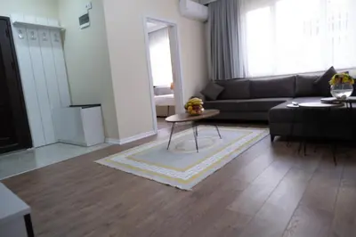 a living room with a couch and a table at GREEN SUITES BURSA in Bursa