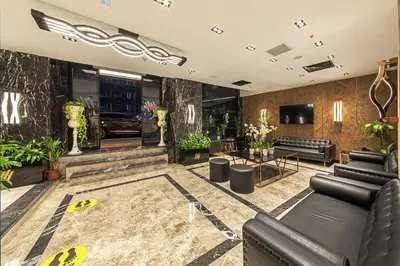 a lobby with couches and a tv in a building at The Halich Hotel Istanbul Karakoy - Special Category in Istanbul