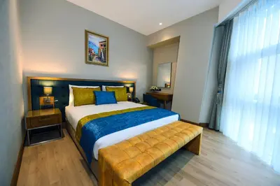 a bedroom with a bed and a large window at CHER HOTEL & SPA Taksim in Istanbul
