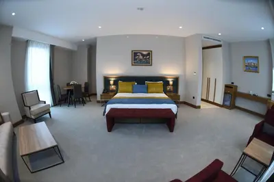 a hotel room with a bed and a table at CHER HOTEL & SPA Taksim in Istanbul