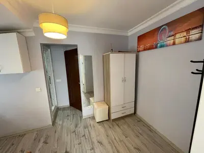 an empty room with a cabinet and a light at Taksim Rain Suite in Istanbul