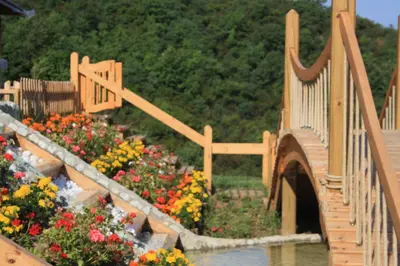 a model of a bridge and flowers in a garden at Zumrut Bahce in Gokcedere