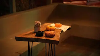 a table with pumpkins on it in a bath tub at Treetops Park Hotel in Sile
