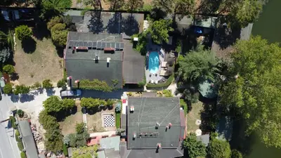 an aerial view of a house with a pool at Treetops Park Hotel in Sile