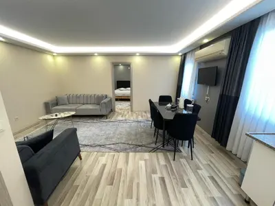 a living room with a couch and a table at Kubbe House in Istanbul