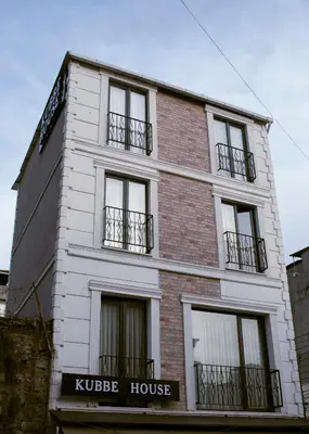 a white building with windows on the side of it at Kubbe House in Istanbul