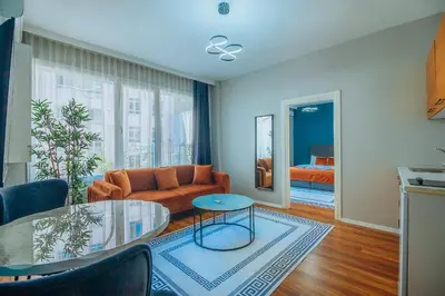 a living room with a couch and a glass table at Taksim Wonder Suites in Istanbul
