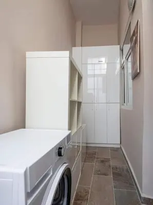 a white laundry room with a washer and dryer at High Ceiling Authentic Historic Ottoman Home! #49 in Istanbul