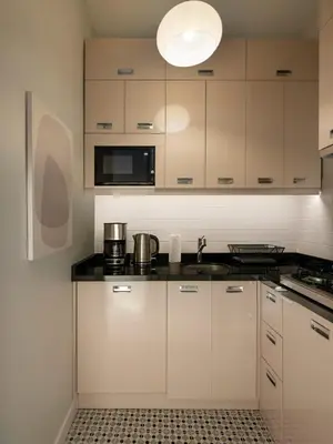 a kitchen with white cabinets and a sink at High Ceiling Authentic Historic Ottoman Home! #49 in Istanbul