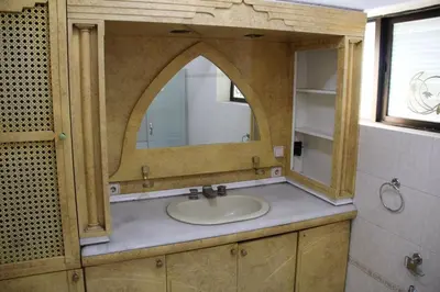 a bathroom with a sink and a mirror at Abbasi Apart (H) in Çekirge