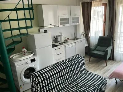 a kitchen with a washer and a washing machine at Istanbul Hub Flats in Istanbul