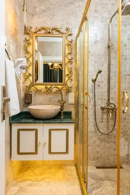 a bathroom with a sink and a shower with a mirror at Begonville Mansion Oldcity in Istanbul