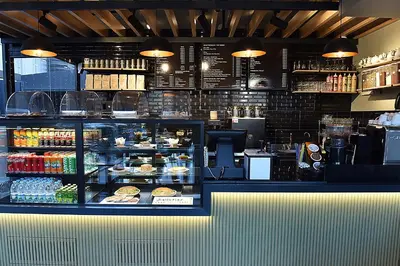 a restaurant with a counter with food on display at Kerthill Hotel in Istanbul