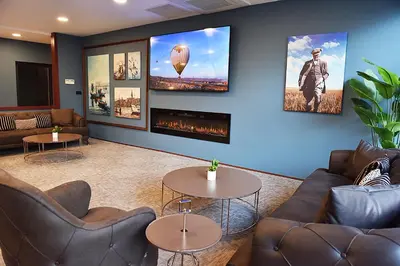 a waiting room with couches and a fireplace at Kerthill Hotel in Istanbul