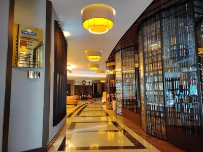 a hotel hallway with a lobby with a glass floor at Days Hotel by Wyndham Istanbul Maltepe in Istanbul