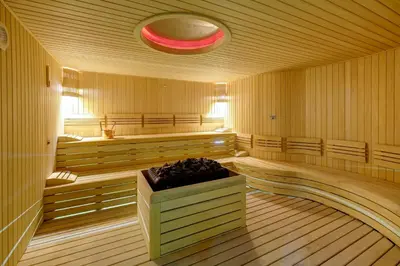 a large empty sauna with a red light on the ceiling at Days Hotel by Wyndham Istanbul Maltepe in Istanbul