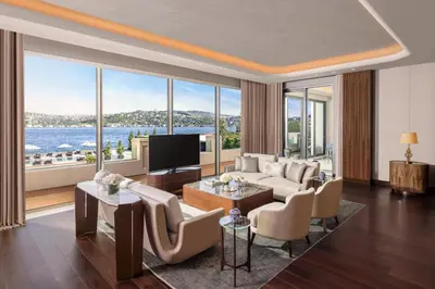 a living room with a couch and a tv at Mandarin Oriental Bosphorus, Istanbul in Istanbul