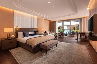 a bedroom with a large bed and a living room at Mandarin Oriental Bosphorus, Istanbul in Istanbul