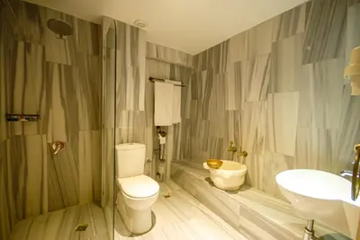 a bathroom with a toilet and a sink at Sultanahmet Enjoyer Suites in Istanbul