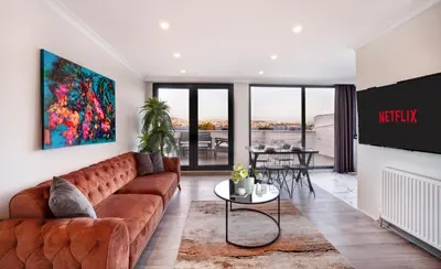 a living room with a brown couch and a table at Etiz Hotels & Residences in Istanbul