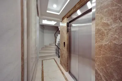 a hallway with a door and stairs in a building at Etiz Hotels & Residences in Istanbul