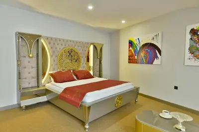 a bedroom with a large bed with red pillows at Ghan Hotel in Istanbul