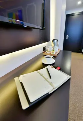 a desk with a notebook and a pen on it at Ghan Hotel in Istanbul