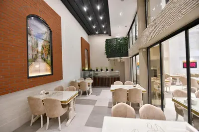 a restaurant with tables and chairs in a room at Ghan Hotel in Istanbul