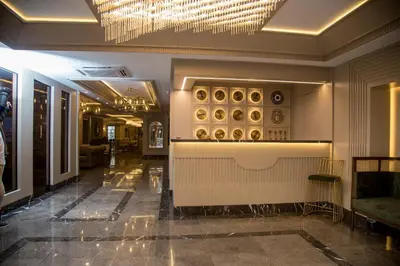 a lobby of a hotel with a chandelier at The Charm Hotel - Old City in Istanbul