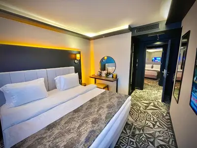 a bedroom with a large white bed in a room at Weingart Istanbul in Istanbul