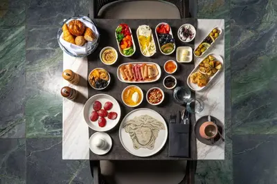 a table with a bunch of different types of food at Orientbank Hotel Istanbul, Autograph Collection in Istanbul