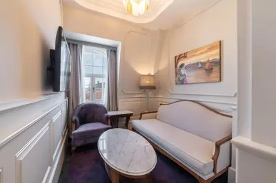 a living room with a couch and a table at Orientbank Hotel Istanbul, Autograph Collection in Istanbul